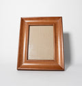 Wooden picture frame on a white background