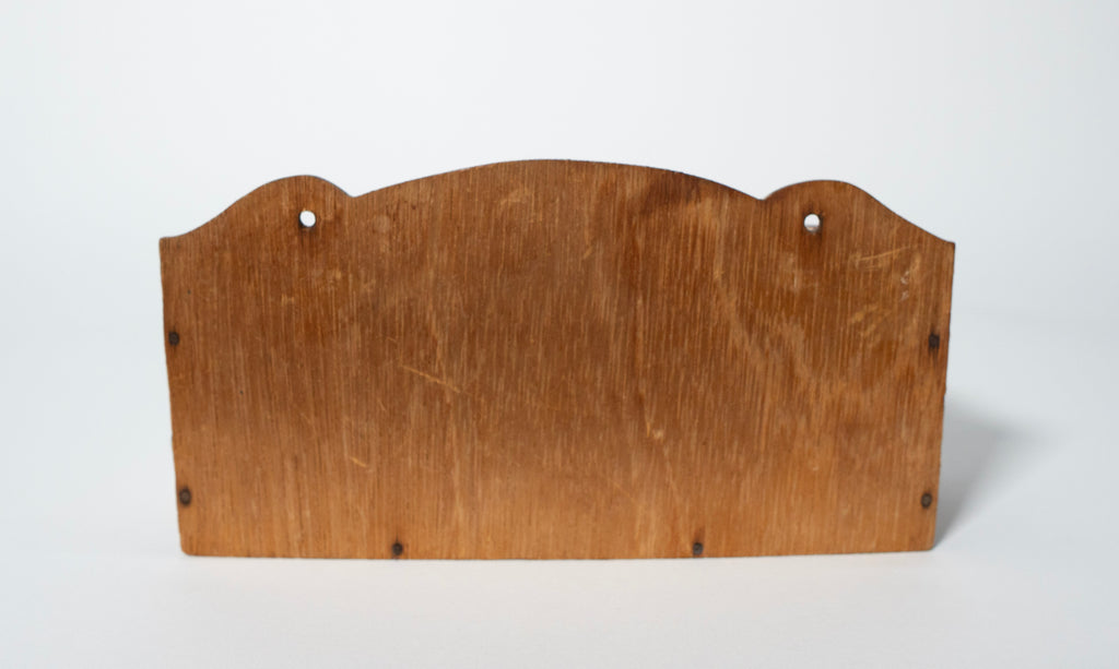 Back of wooden spice rack on a white background