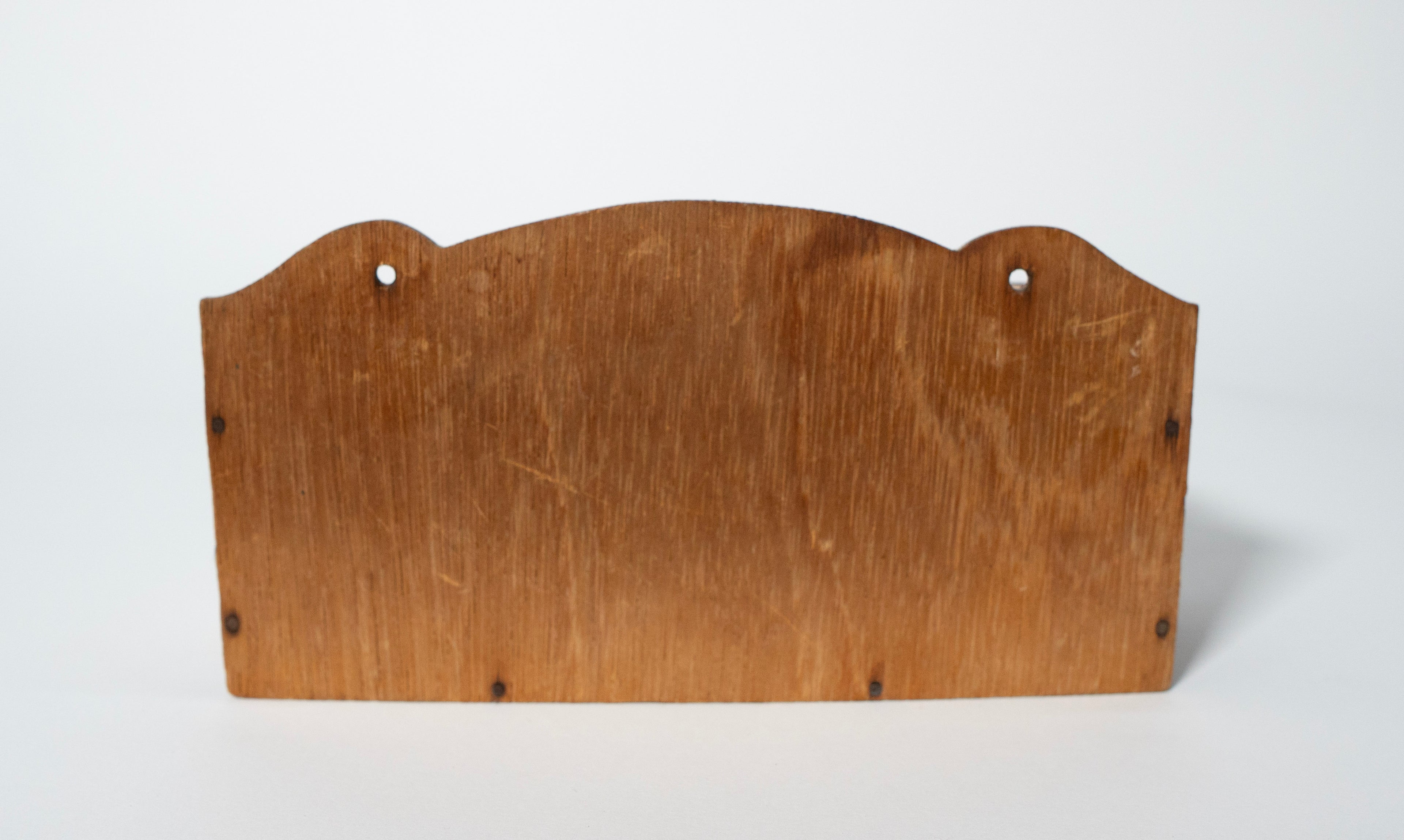 Back of wooden spice rack on a white background