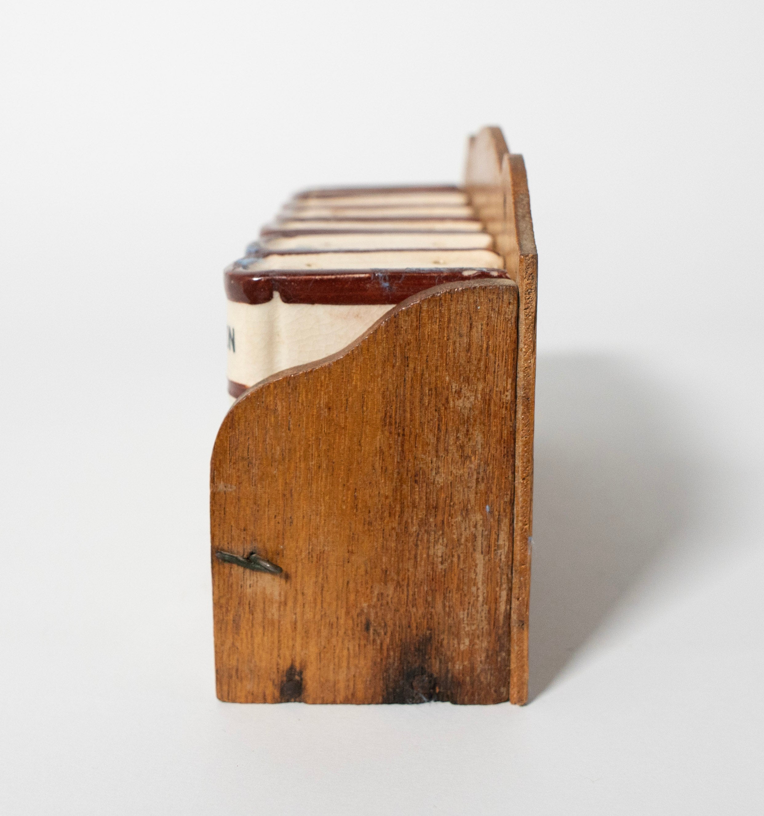 side view of spice rack on a white background