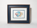 Framed artwork of a colorful fish on a white background