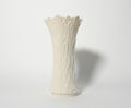 White textured vase on a light gray background