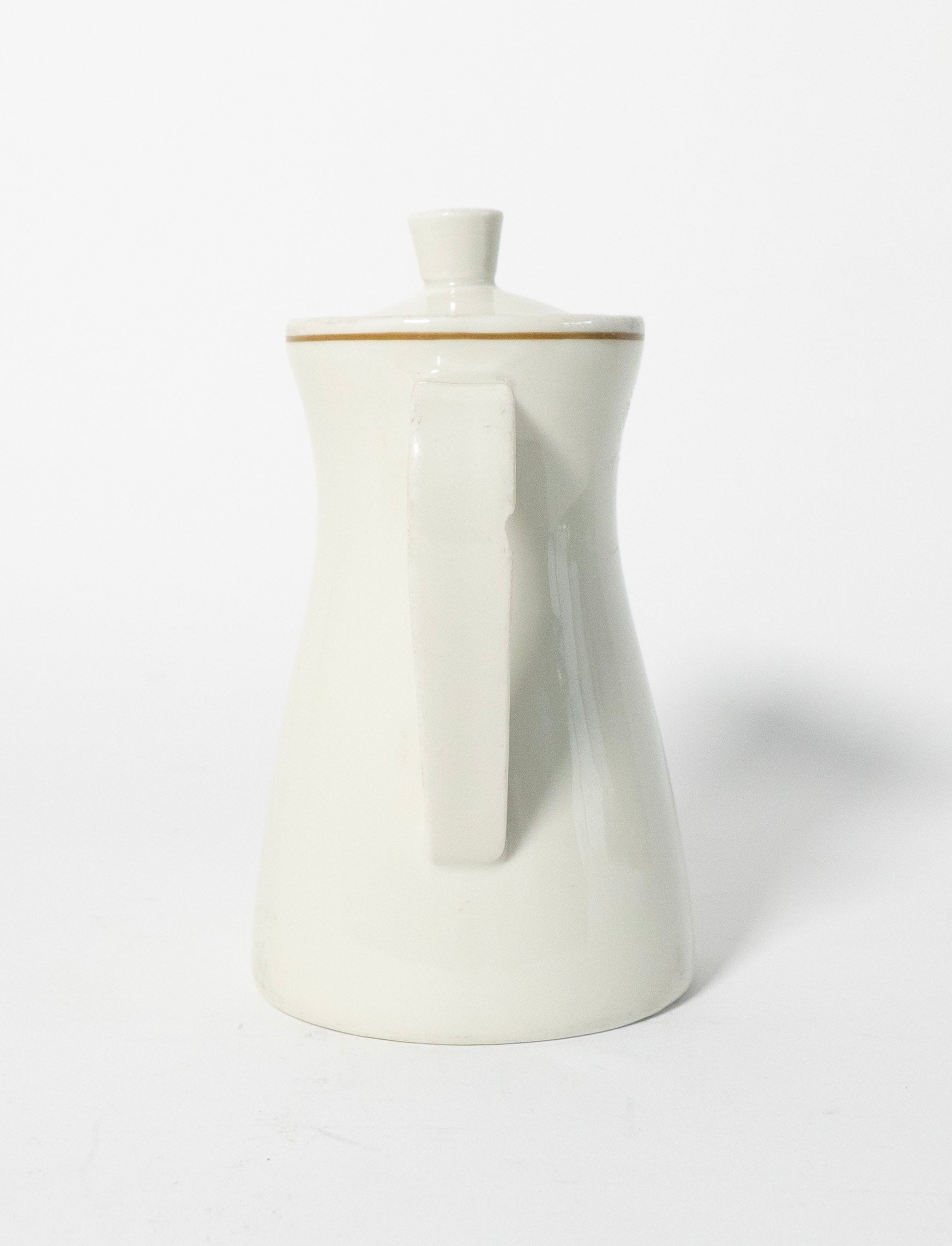 White ceramic pitcher with a narrow neck and wider body on a white background