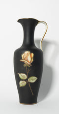 Black vase with a gold rim and a painted rose on a white background