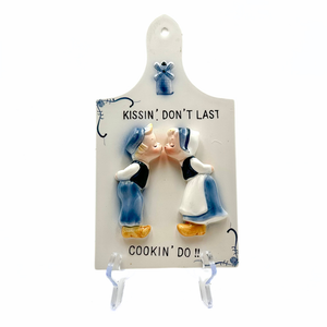 Kissin Don't Last Cookin Do Ceramic Dutch Wall Plaque