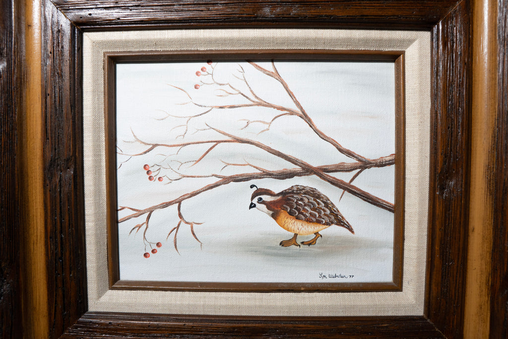 Framed painting of a bird on a branch with berries