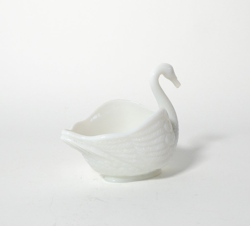 White ceramic swan-shaped bowl on a white background