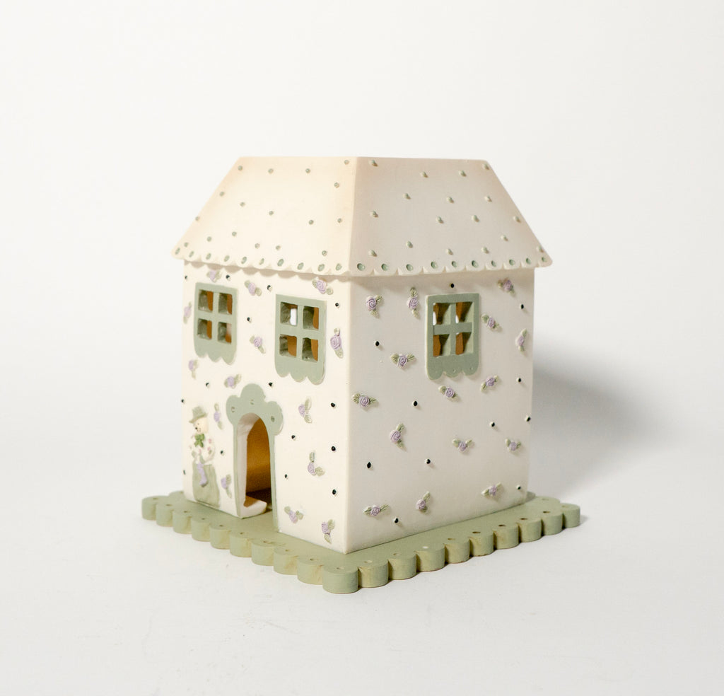Decorative house-shaped light on a white background