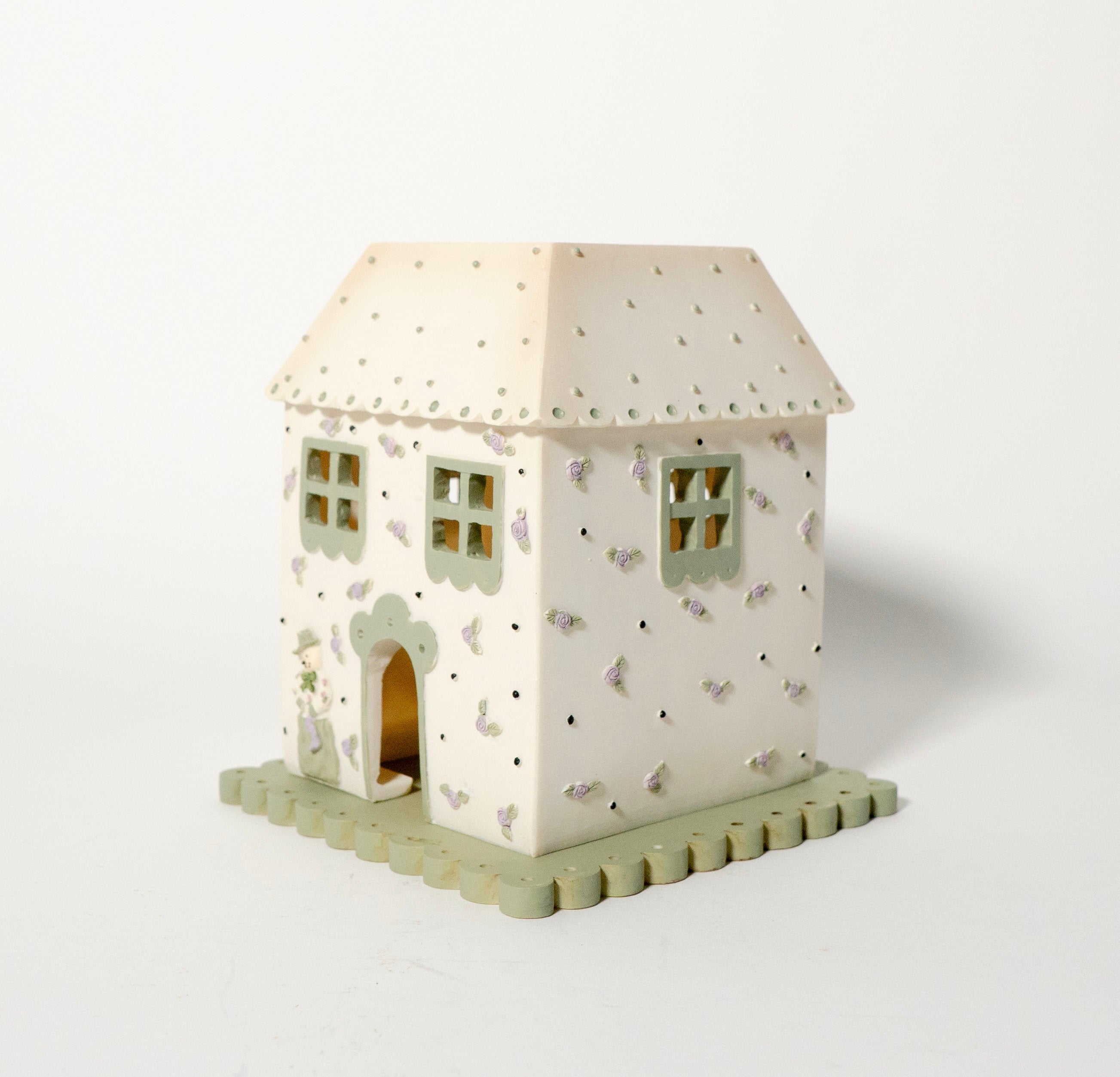 Decorative house-shaped light on a white background