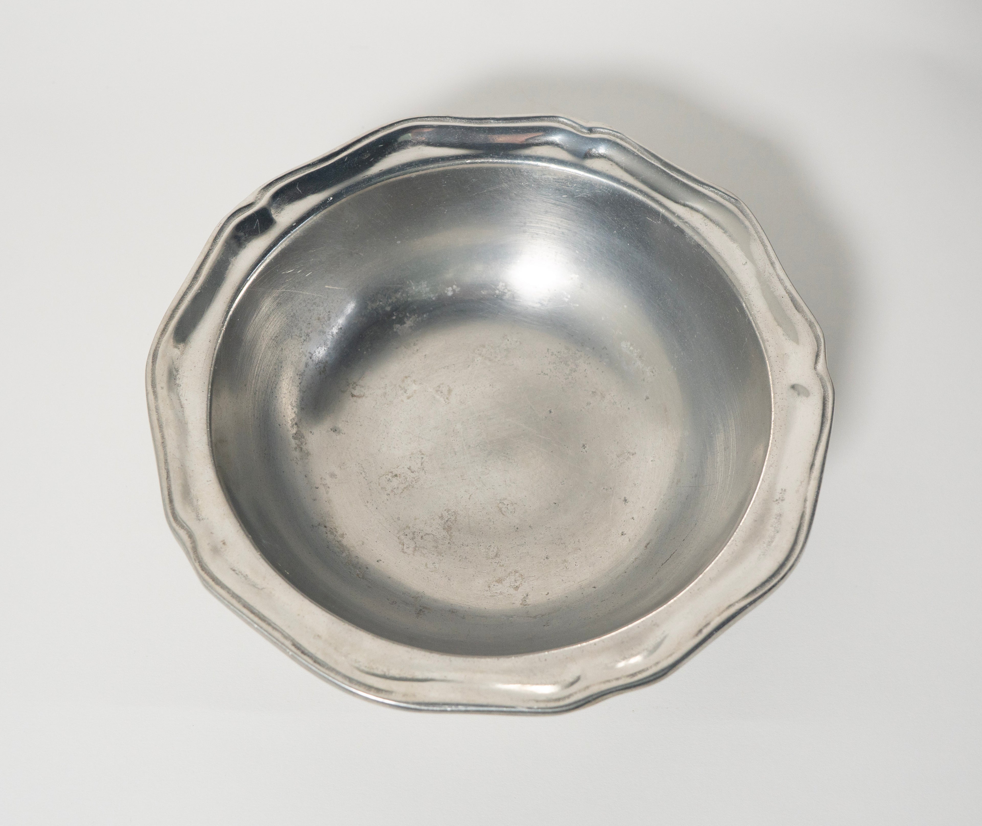 Silver octagonal dish on a light gray background