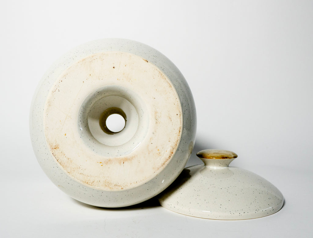 Ceramic pot with a lid on a white background